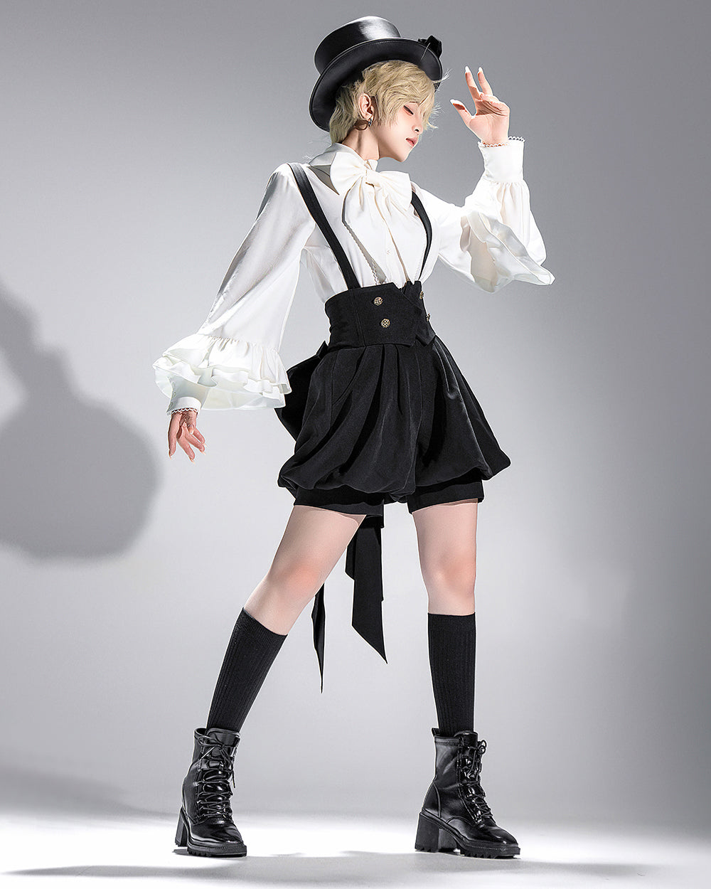 Stylish Black High-Waisted Suspender Shorts with Flared Skirt Overlay