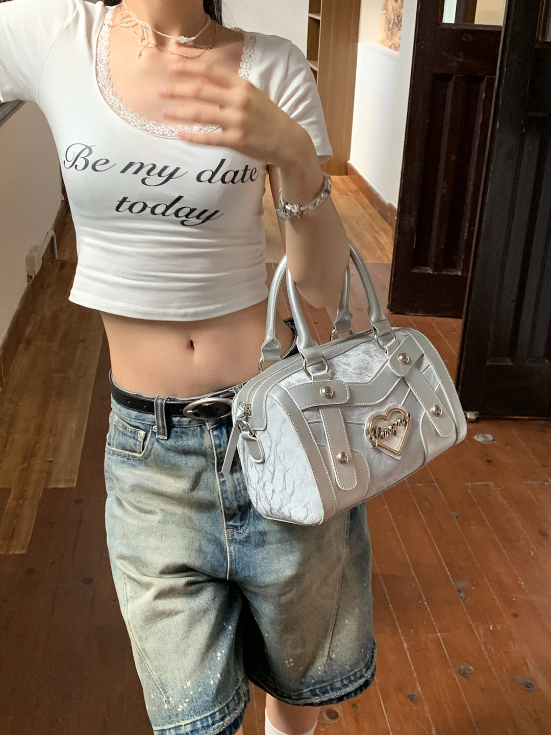 Chic Silver Metallic Handbag with Heart Emblem