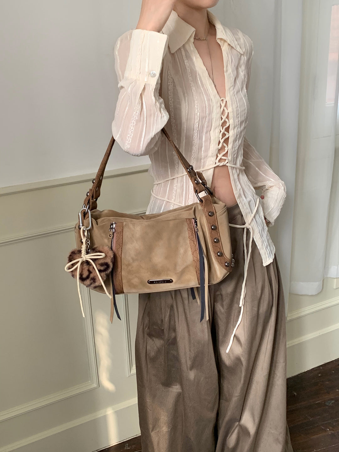 Chic Crinkled Leather Crossbody Bag with Metallic Studs