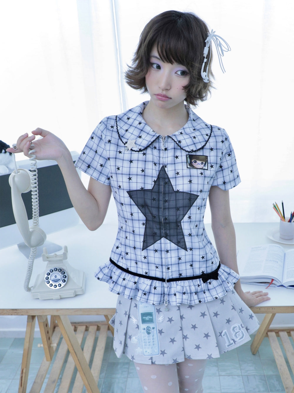Winged Phone Patch Pleated Mini Skirt