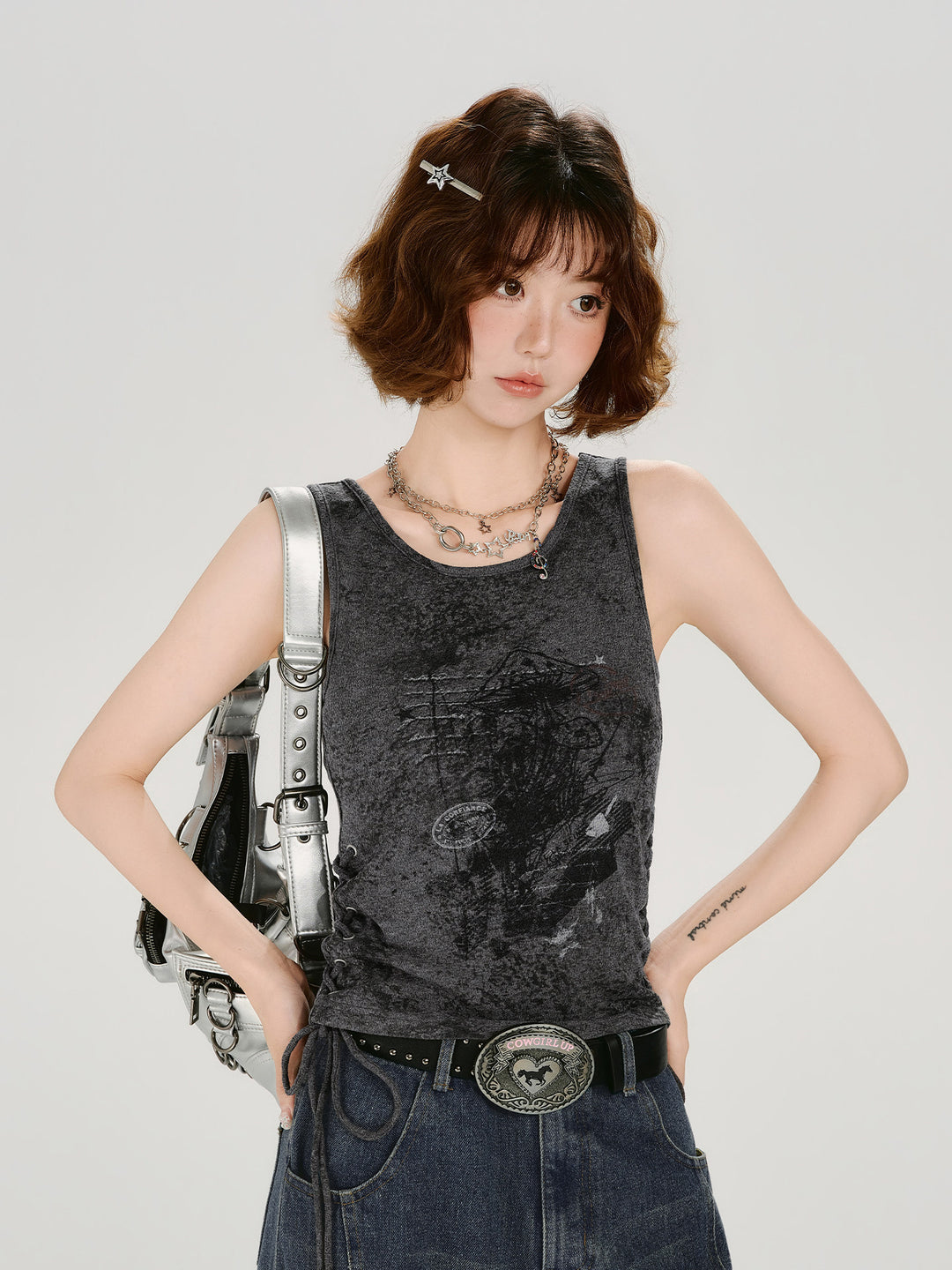 Dark grey acid wash tank top with side lace-up drawstring and vintage graphic.