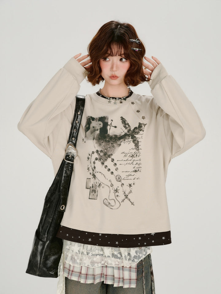 Dark navy striped long sleeve shirt with cat, moon, and star embroidery detail.