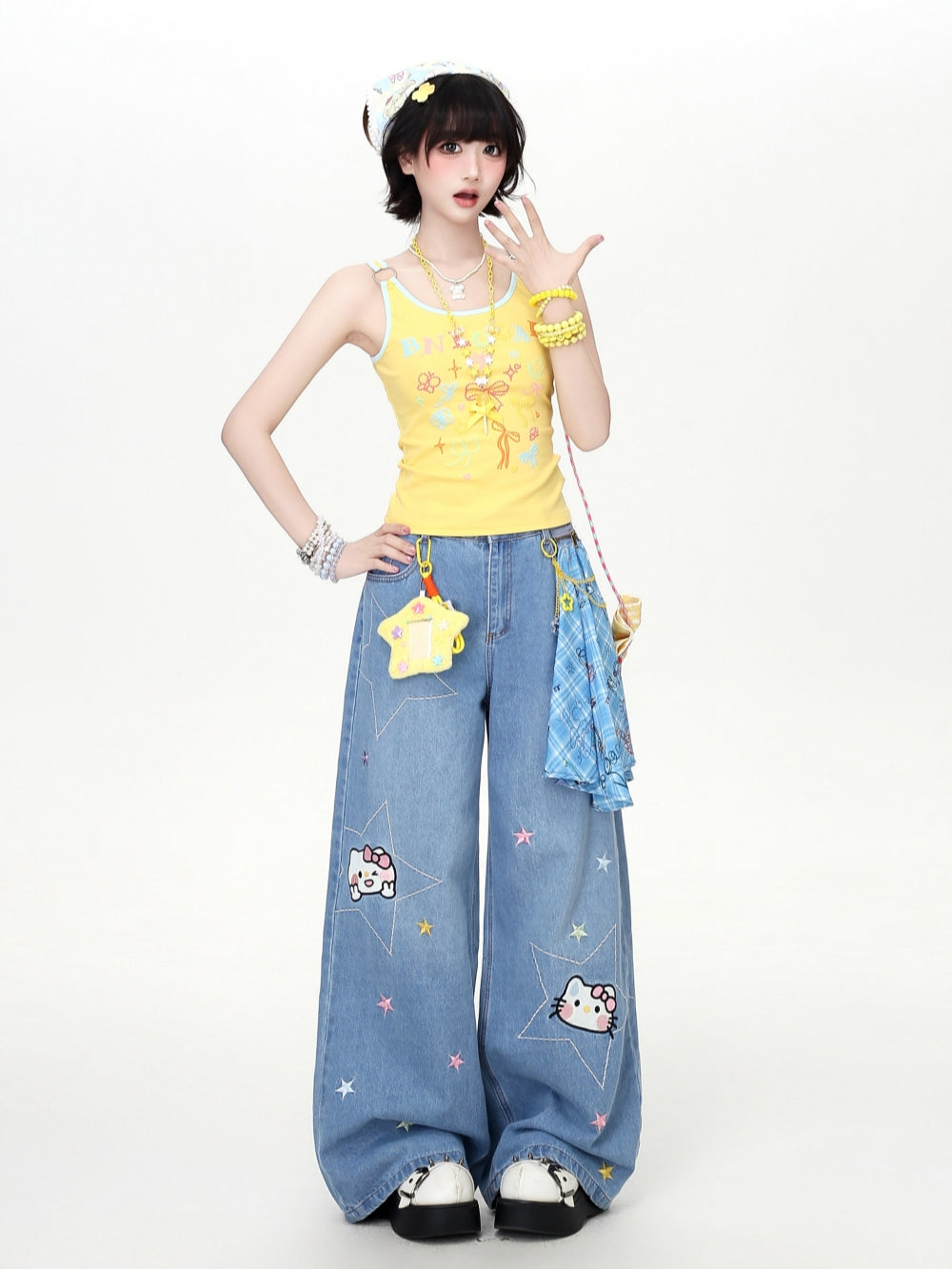 Model wearing a bright yellow and pastel blue Cyber Y2K kawaii aesthetic tank top with contrast trim and metal ring straps.