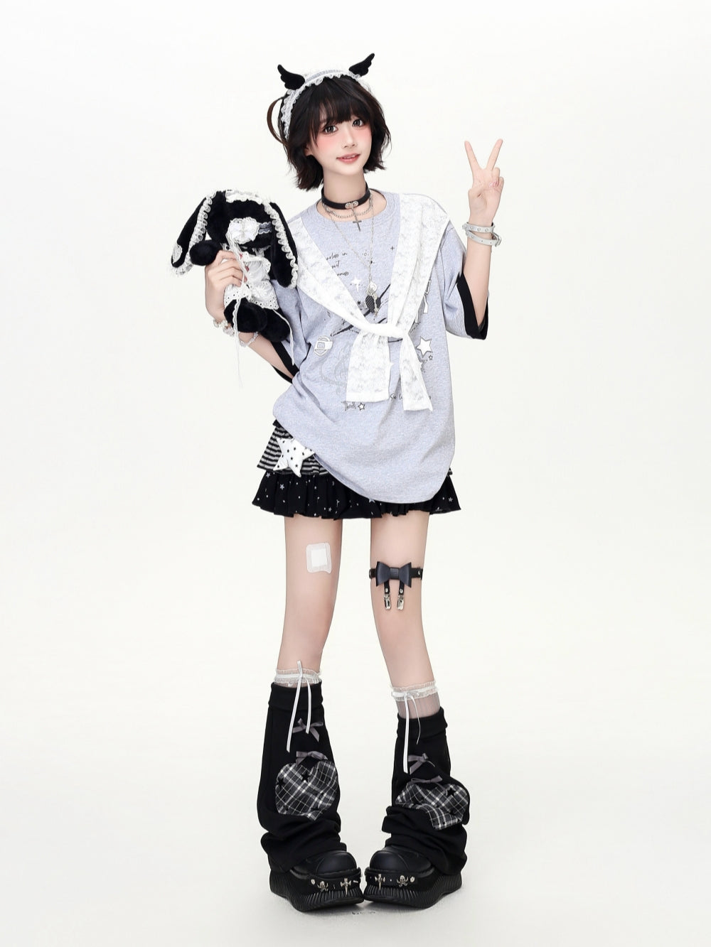 An oversized Japanese subculture aesthetic graphic tee in grey and white colorways, featuring a built-in white lace sailor collar and Y2K cyber-grunge graphics, styled for an alternative aesthetic.