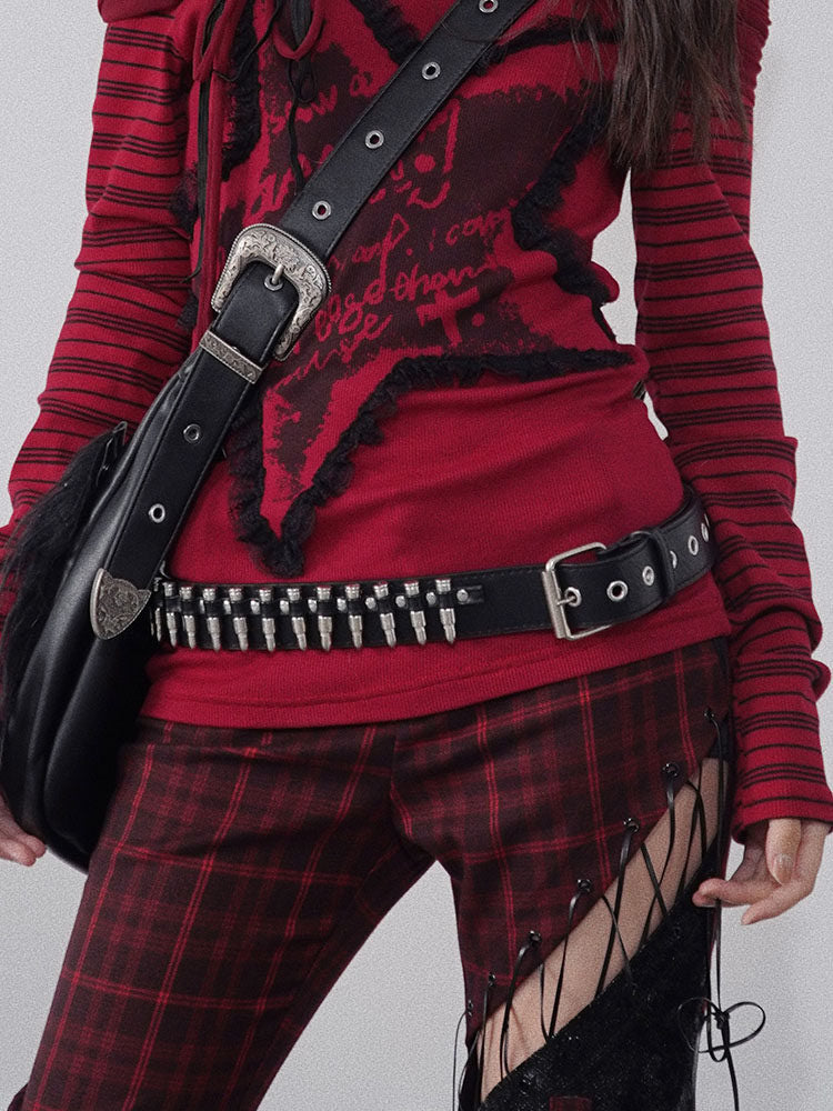Black belt with a row of silver-colored bullet-shaped studs across the front and a rectangular buckle beside two rows of grommets.