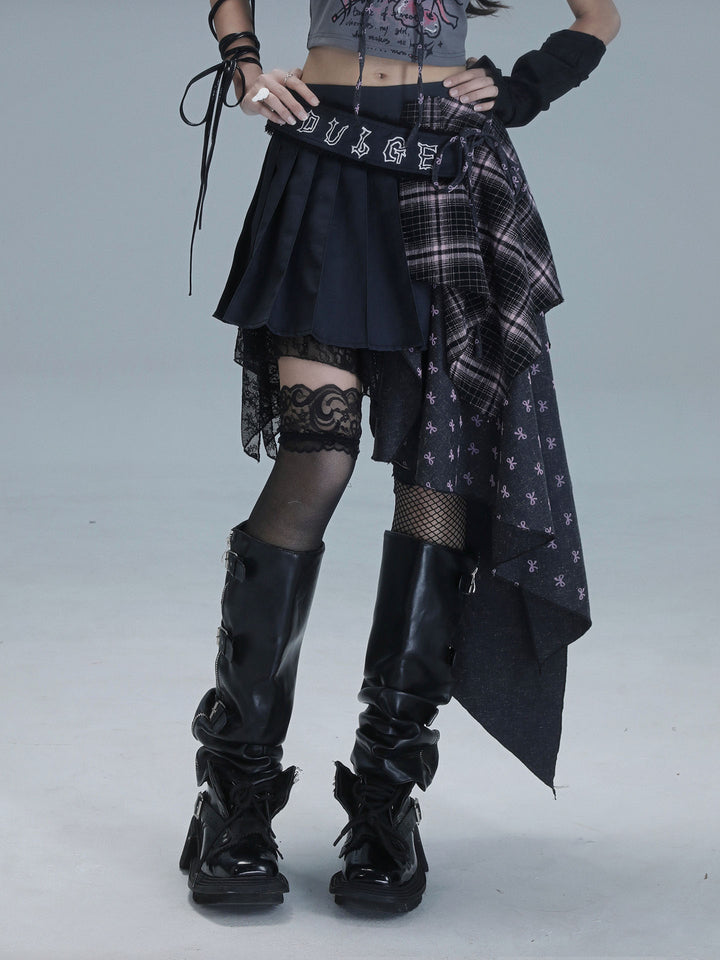 Black pleated punk skirt with plaid panels and a small bow-print section draping down one side to create a long asymmetric hem.
