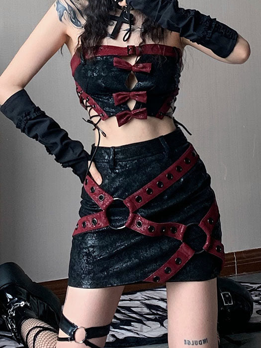 Black punk tube top with three burgundy bows along the front cutouts, a buckled burgundy neckline band, and crisscross lacing at the sides.