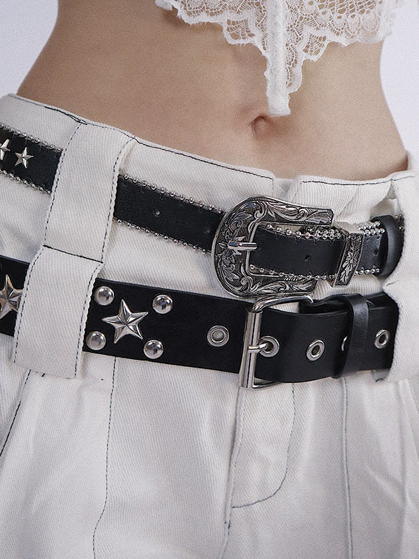 Black belt with an ornate engraved western buckle, a matching engraved keeper, and small star studs bordered by beaded edging.