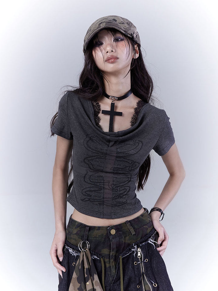 Camouflage headscarf with two hanging rings and small round studs along the front edge, draping into a point at the back.