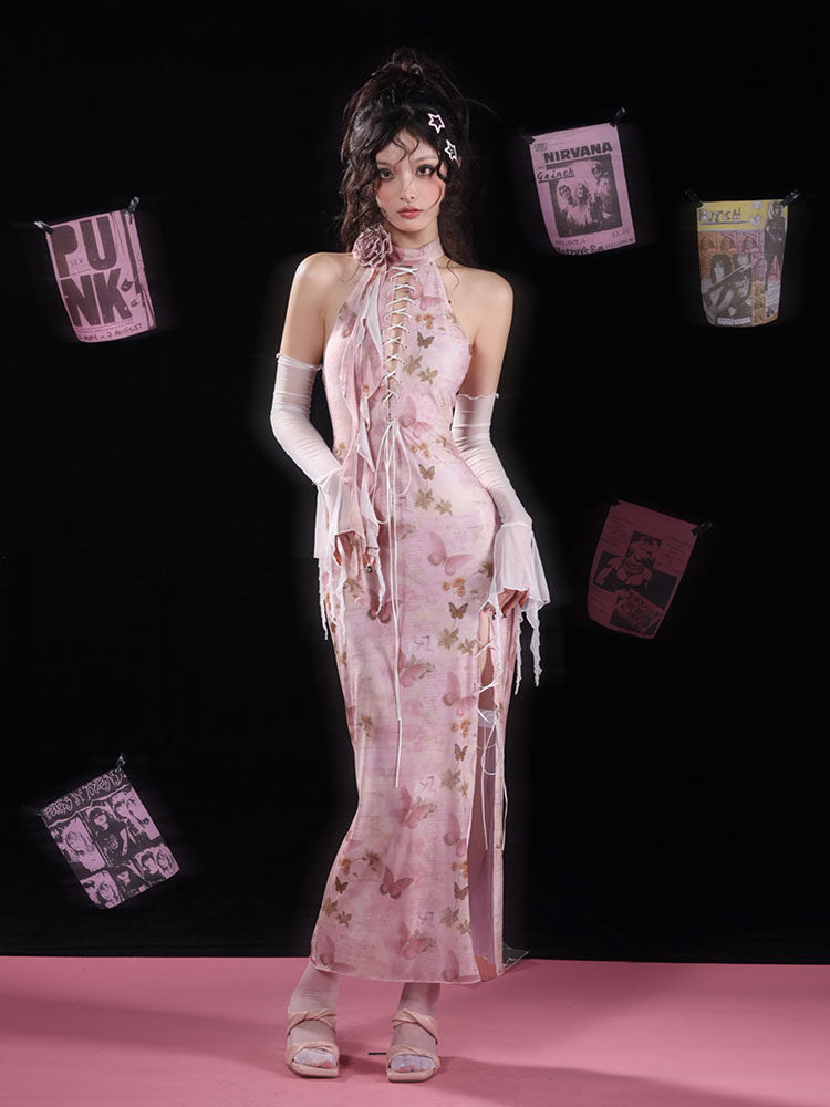Pink butterfly-print halter maxi dress with white lacing down the chest and along a high side slit, finished with long hanging ties.