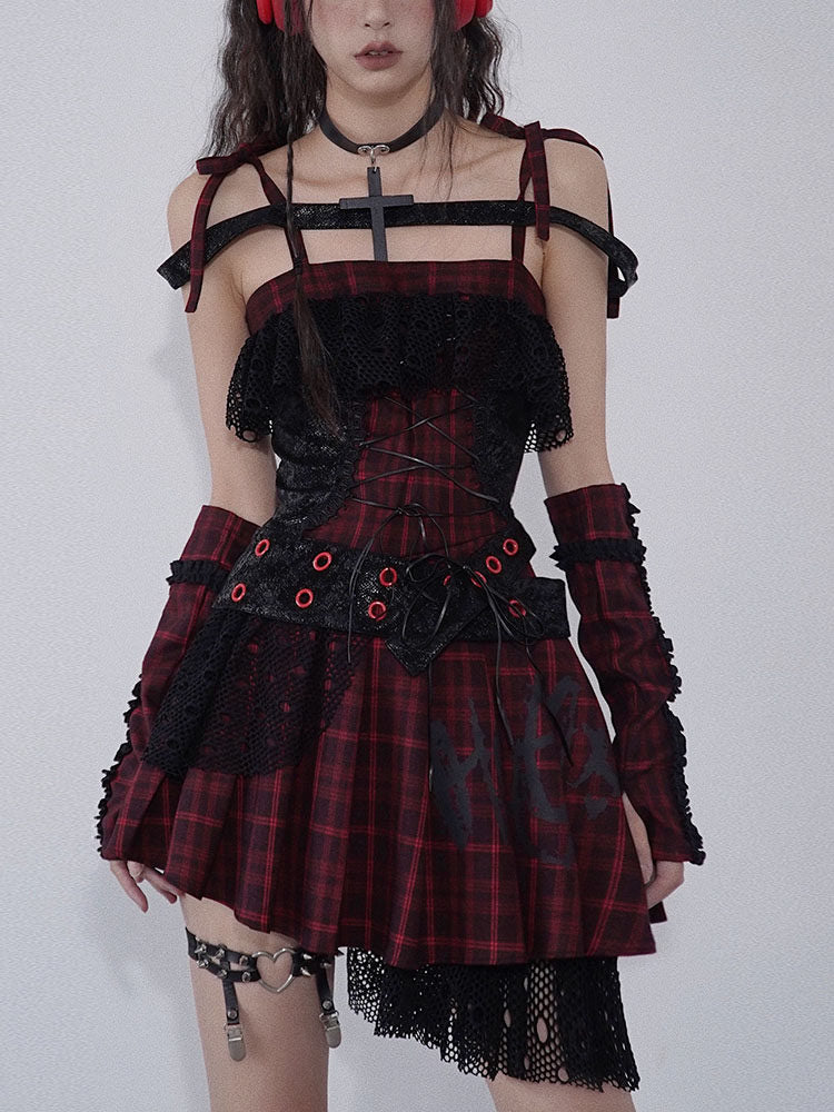 Red and black plaid punk dress with a lace-up bodice, black ruffles across the chest, and a pleated skirt with an uneven black overlay.
